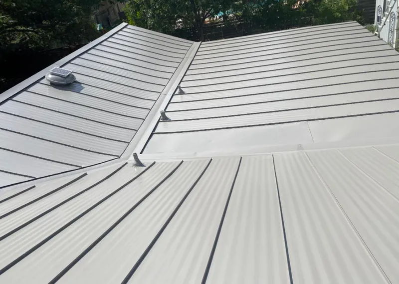 Solar attic fan installed on a metal roof for Roof Ventilation in Travilah